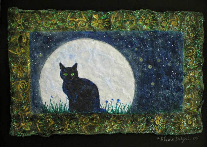 Black cat against a full moon